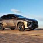 grey hyundai tucson driving on road