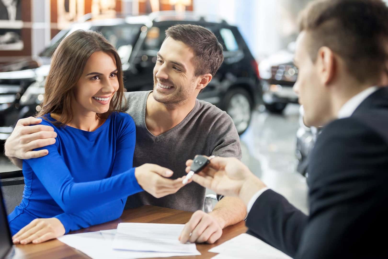 Couple receiving car keys