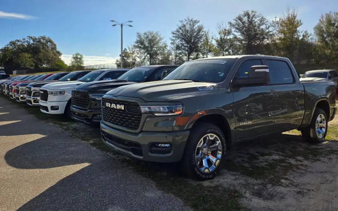 Several RAM models displayed in front of Jim Browne CDJR in Florida