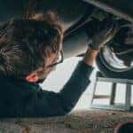 Man Fixing Vehicle Engine
