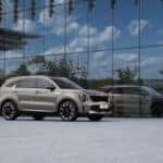 a silver car parked in front of a building