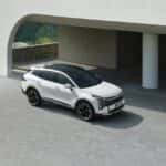 Modern White SUV Parked Under Concrete Structure