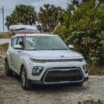 White Car Parked on Dirt Road