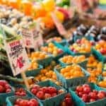 Red tomatoes in blue baskets