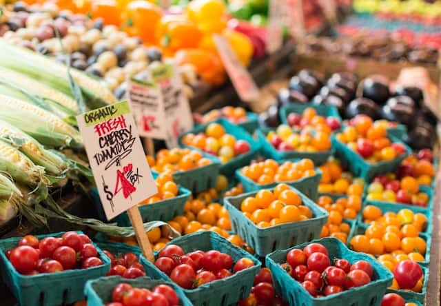 Red tomatoes in blue baskets