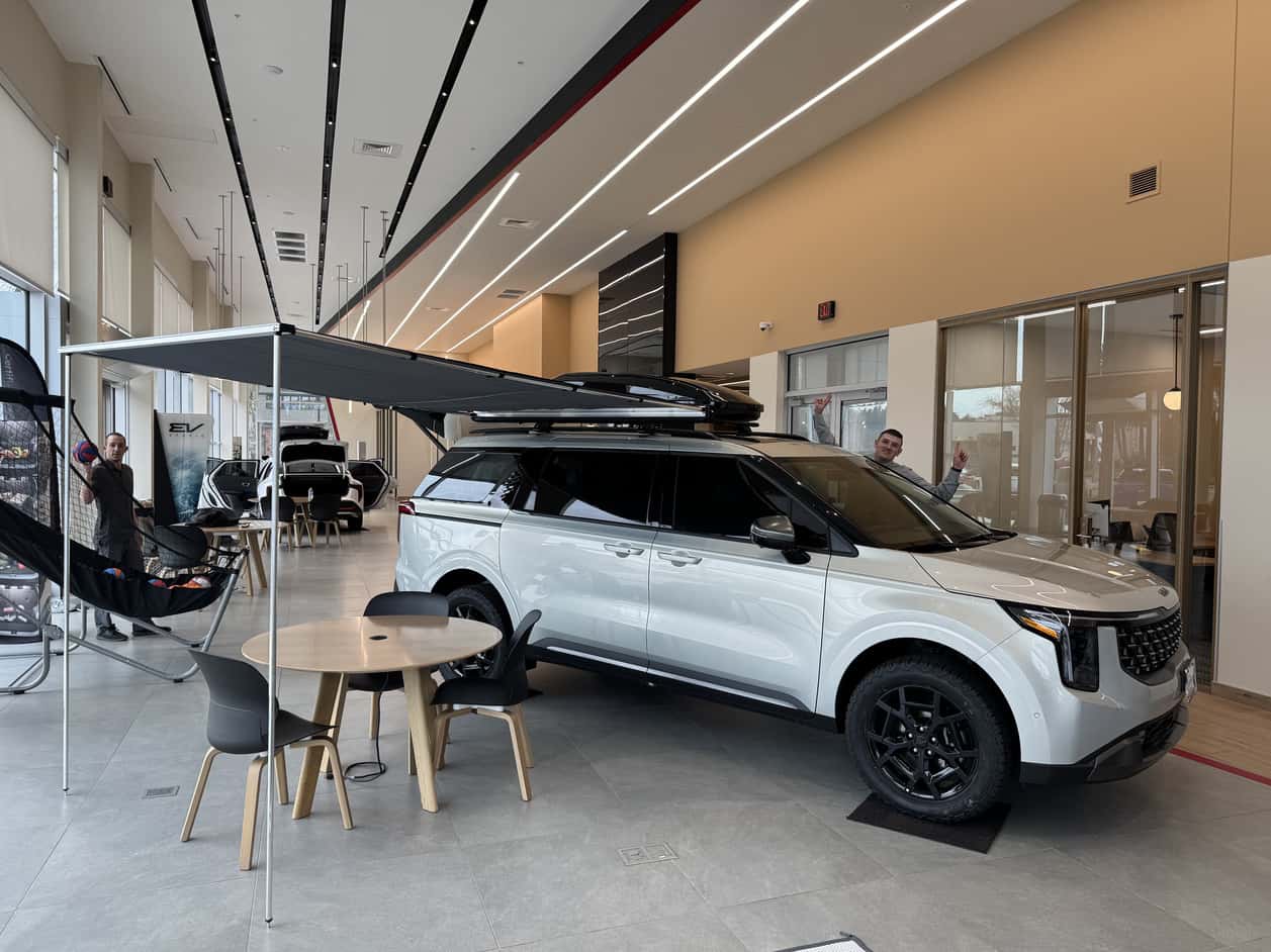 Kia Carnival with roofftop tent in showroom