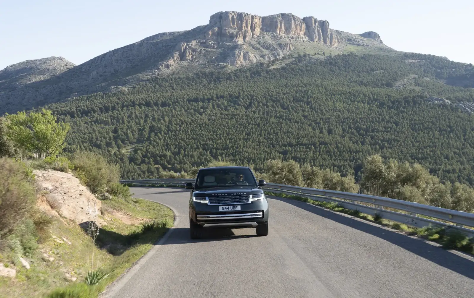 Range Rover Electric driving on a mountain road