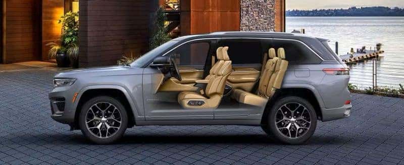 Side view of the 2025 Jeep Grand Cherokee highlighting its two-row seating configuration with tan leather upholstery, emphasizing comfort and spaciousness.