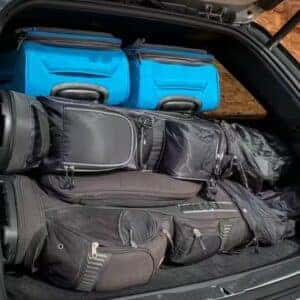Open trunk of Jeep Grand Cherokee loaded with luggage, highlighting spacious cargo capacity.