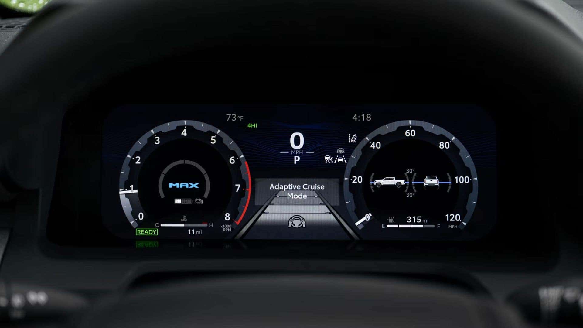 Digital gauge cluster in the Toyota Tacoma displaying adaptive cruise mode and vehicle stats.