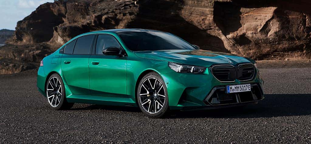 The 2025 BMW M5 on a beach