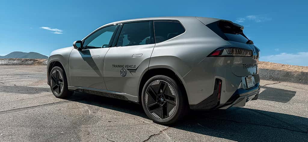 Side profile view of a silver BMW iX3