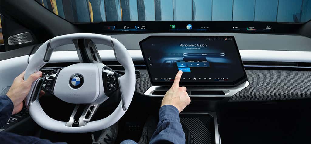 Interior of a BMW iX3 featuring BMW Operating System X and BMW Panoramic Vision iDrive
