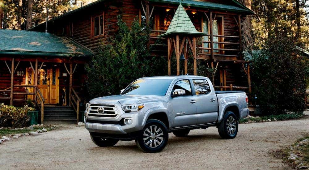 A silver 2022 Toyota Tacoma Limited is shown parked outside a home after visiting a Sinking Spring Auto Dealer.