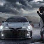 A grey 2023 Toyota GR Corolla is shown from the front in the pits after leaving a Toyota GR Corolla dealership.