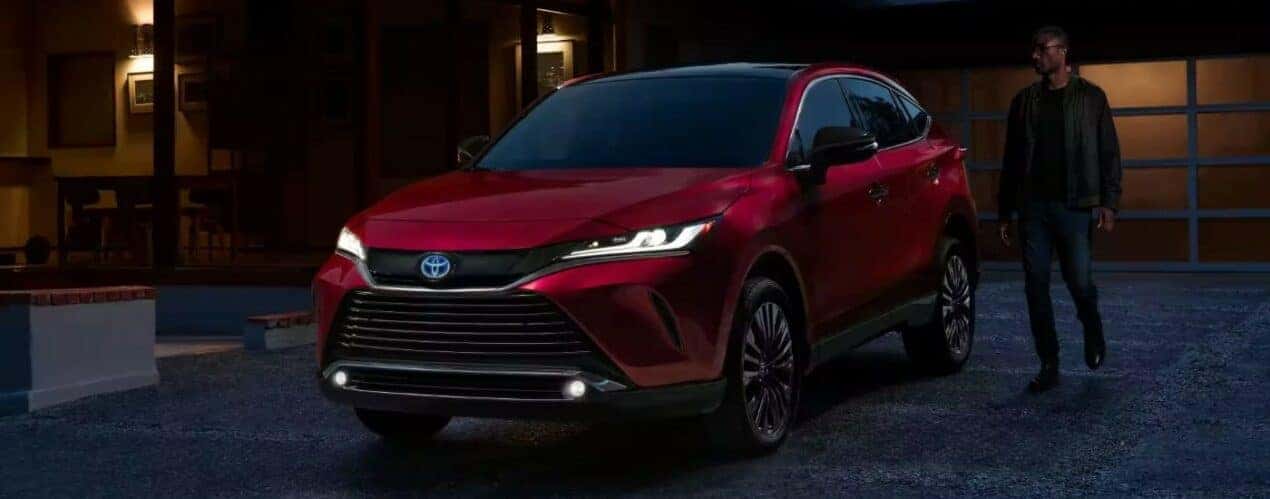 A red 2023 Toyota Venza Nightshade Edition is shown parked on a driveway.