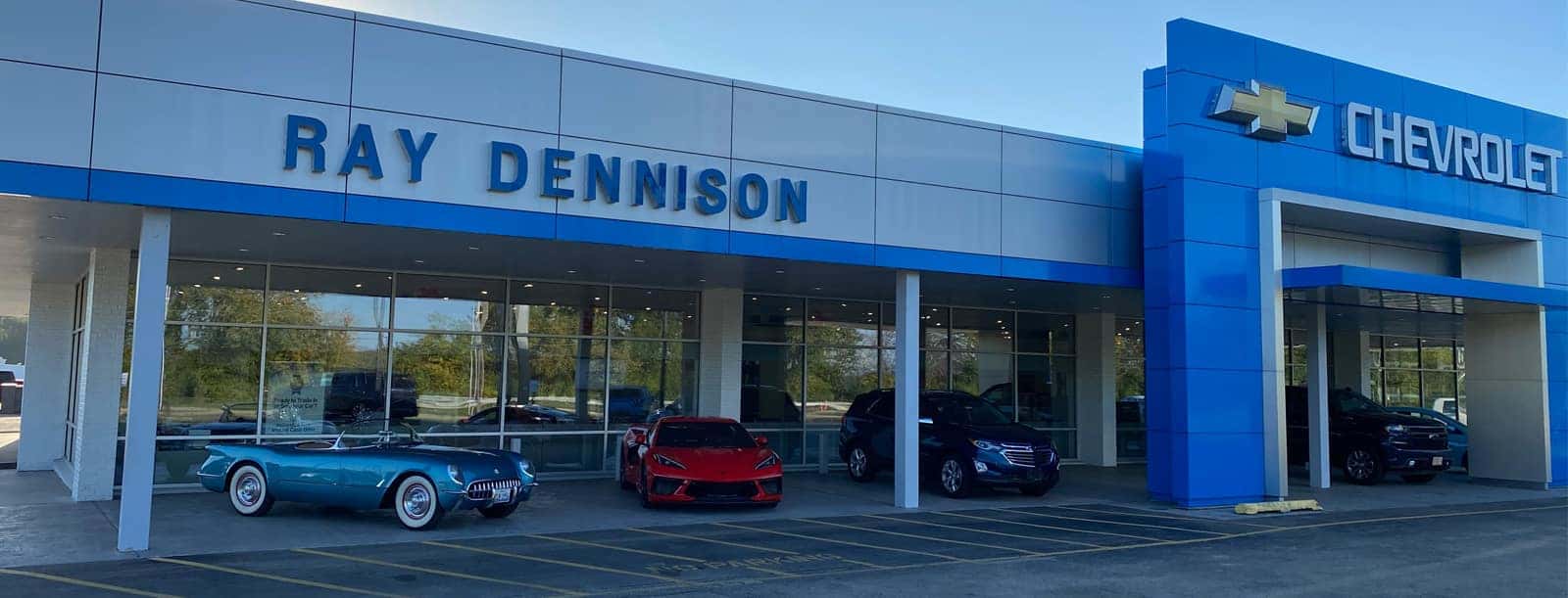 An exterior shot of a Chevrolet dealership at night.