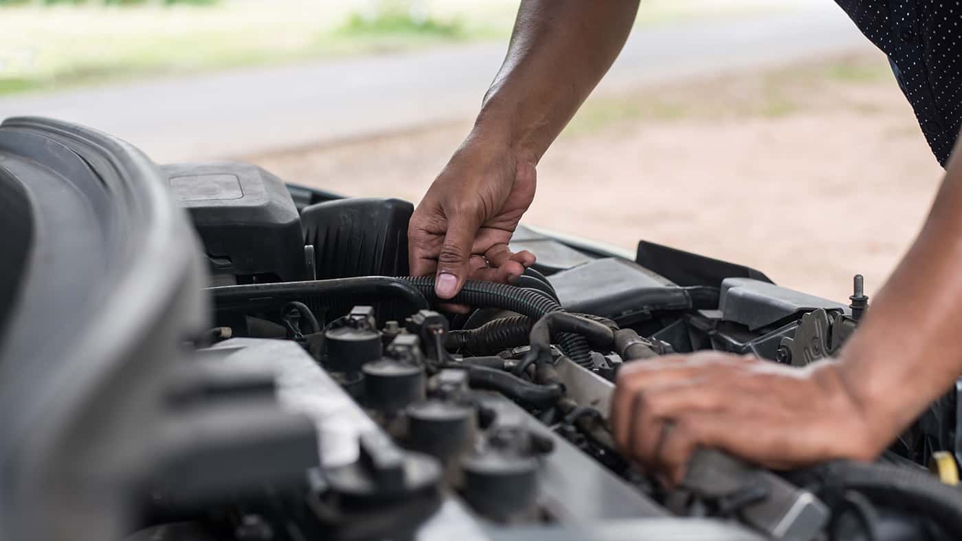 Mechanic Working on Engine