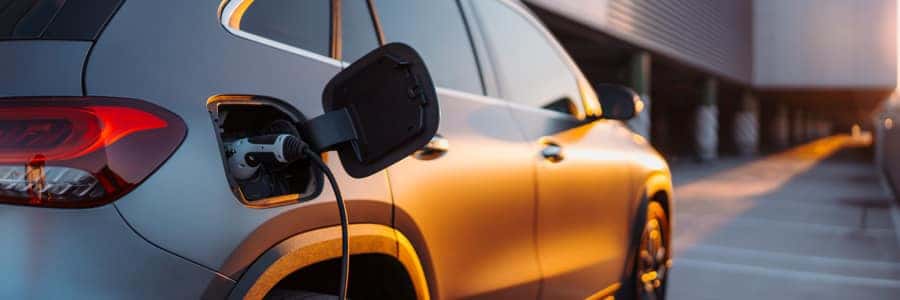 Close-up of electric car charging, ecology transportation concept. Close-up of electric car charging, ecology transportation concept.