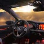 interior of the VW Gold GTI looking over misty mountains through the windows