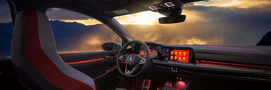 interior of the VW Gold GTI looking over misty mountains through the windows