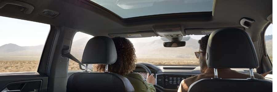 the interior of a an atlas cross sport with grey upholstery and a sunroof
