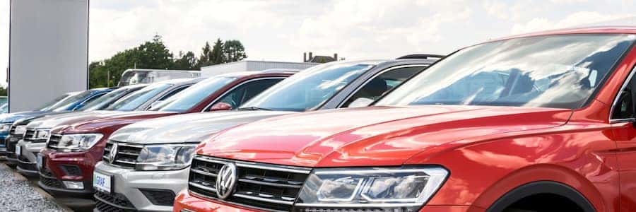 row of Volkswagen cars at a dealership
