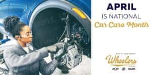 woman automotive technician fixing vehicle