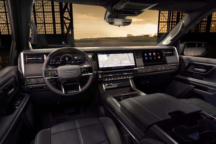 2027 GMC Sierra 1500 Denali Ultimate interior with 16.3-inch infotainment screen and Head Up Display