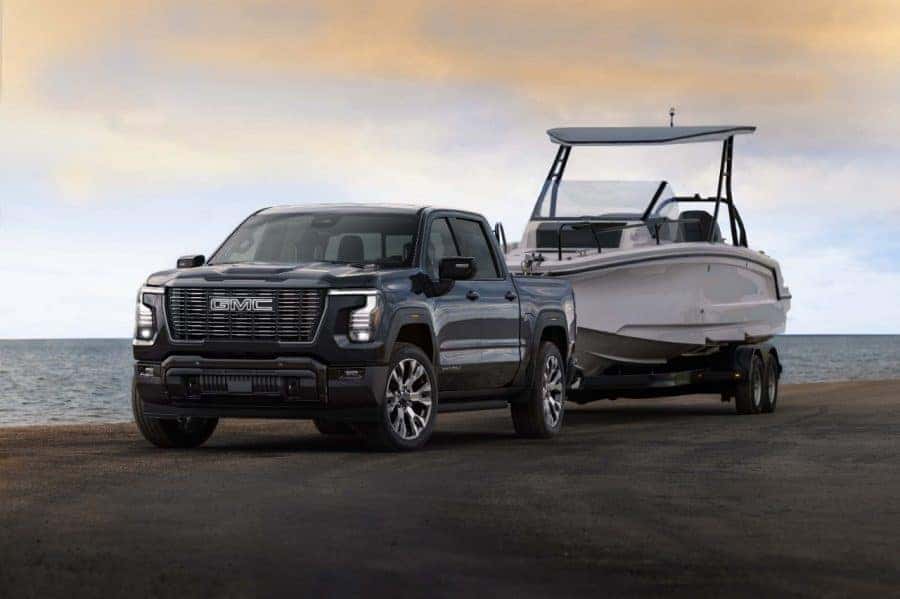 2027 GMC Sierra 1500 Denali Ultimate towing a boat — Super Cruise trailering capability included standard