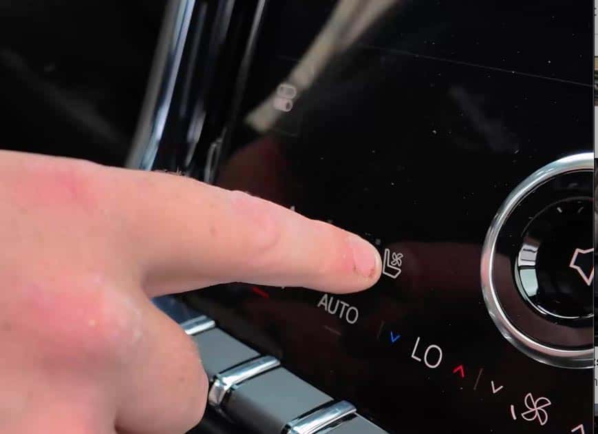 Pressing the seat ventilation button on a GMC Yukon Denali climate control panel