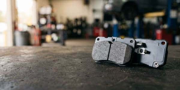 New GM brake pad set on a service department bench